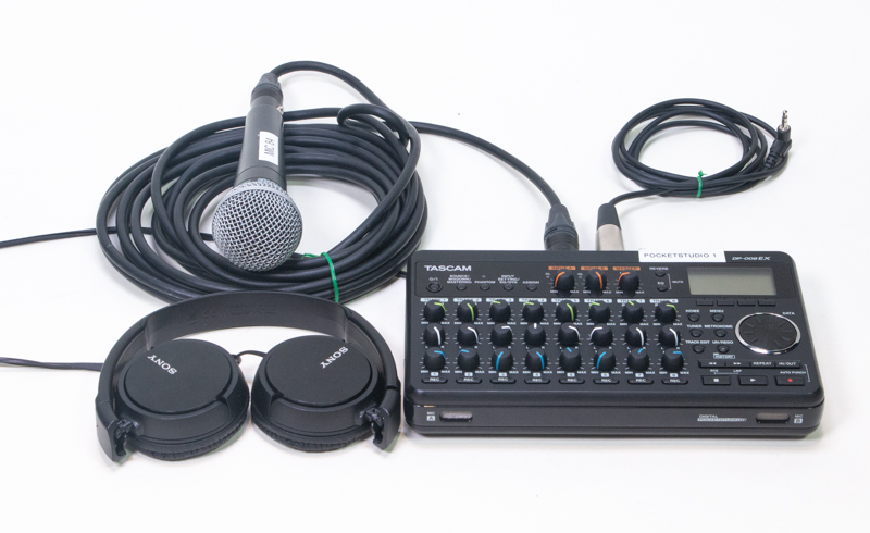A pocketstudio, a microphone, headphones, and wires