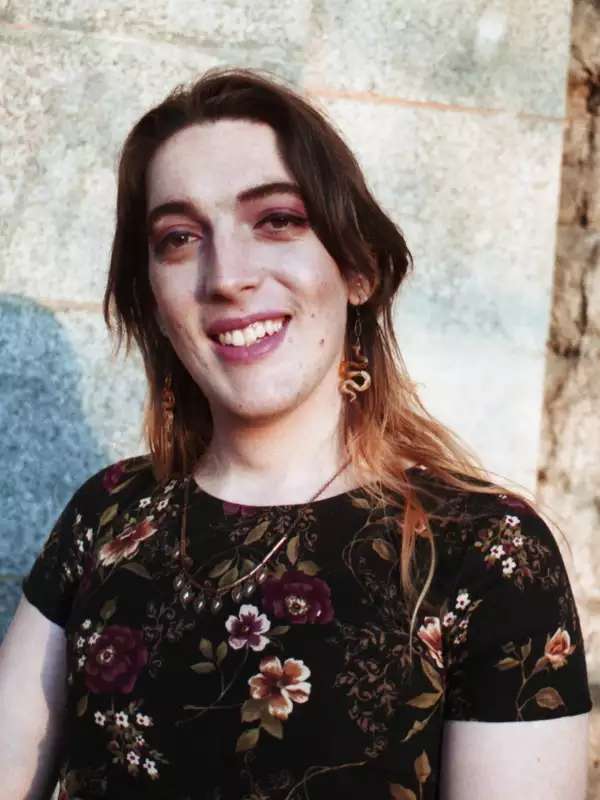 woman with shoulder length-hair wearing a floral top